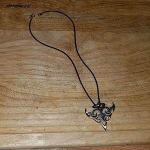 Black necklace with tribal type dangle.